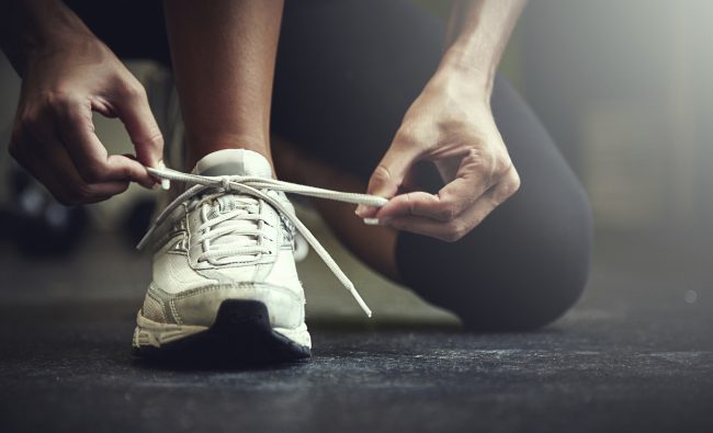 Cropped shot of a young woman tying her shoelaceshttp://195.154.178.81/DATA/i_collage/pu/shoots/806123.jpg