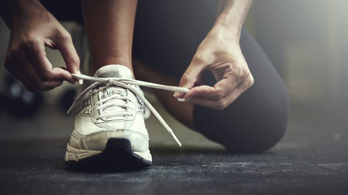 Cropped shot of a young woman tying her shoelaceshttp://195.154.178.81/DATA/i_collage/pu/shoots/806123.jpg