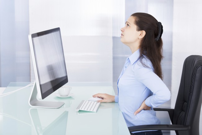Businesswoman Suffering From Back Pain